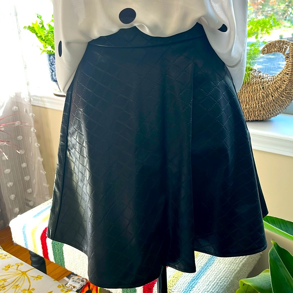 Join the Leather trend this season in this cute mini!!